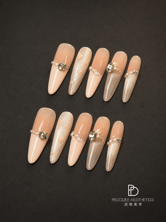 Cream pearl false nail set, almond tips with rhinestone floral accents