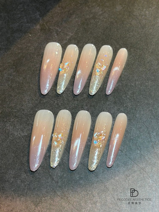 Blush quicksand acrylic press-on nails with glitter and iridescent accents