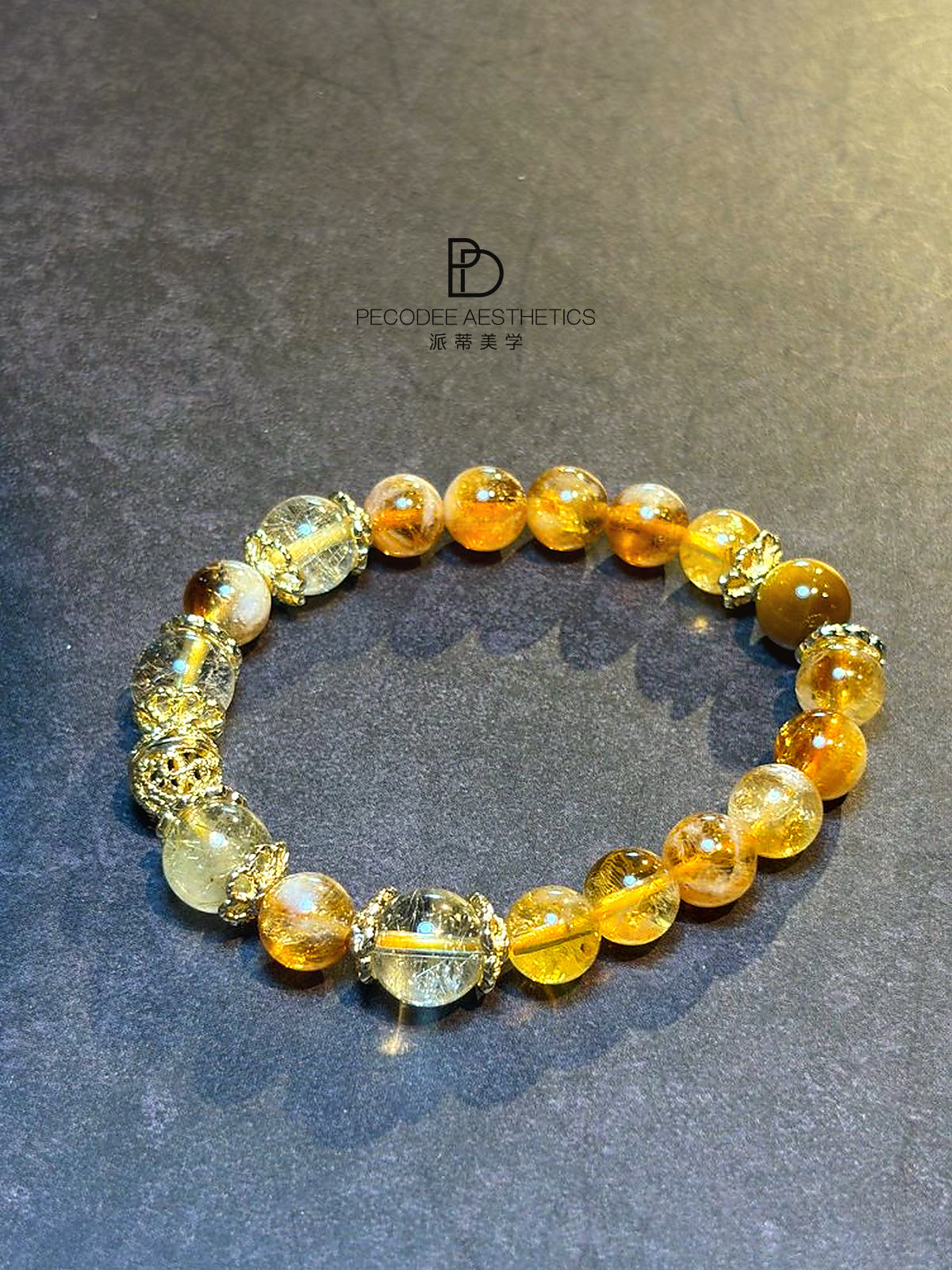 Amber beaded bracelet with mixed clear and golden round beads