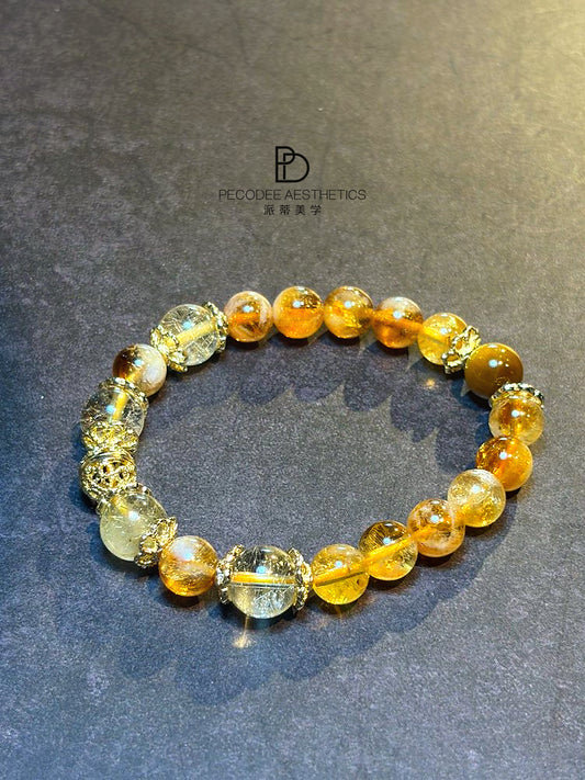 Amber beaded bracelet with mixed clear and golden round beads