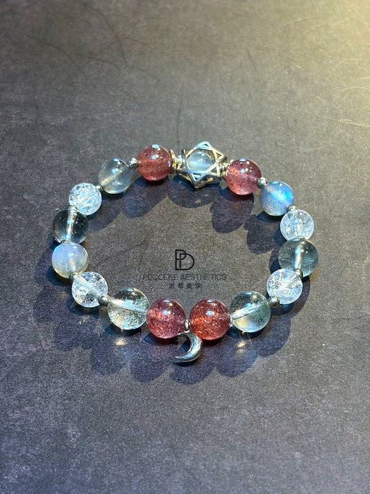 Beaded bracelet with clear and light-blue beads, berry-red beads, silver clasp charm