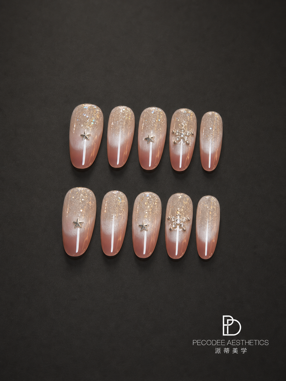 Rose-toned acrylic press-on nails with star accents and glitter tips