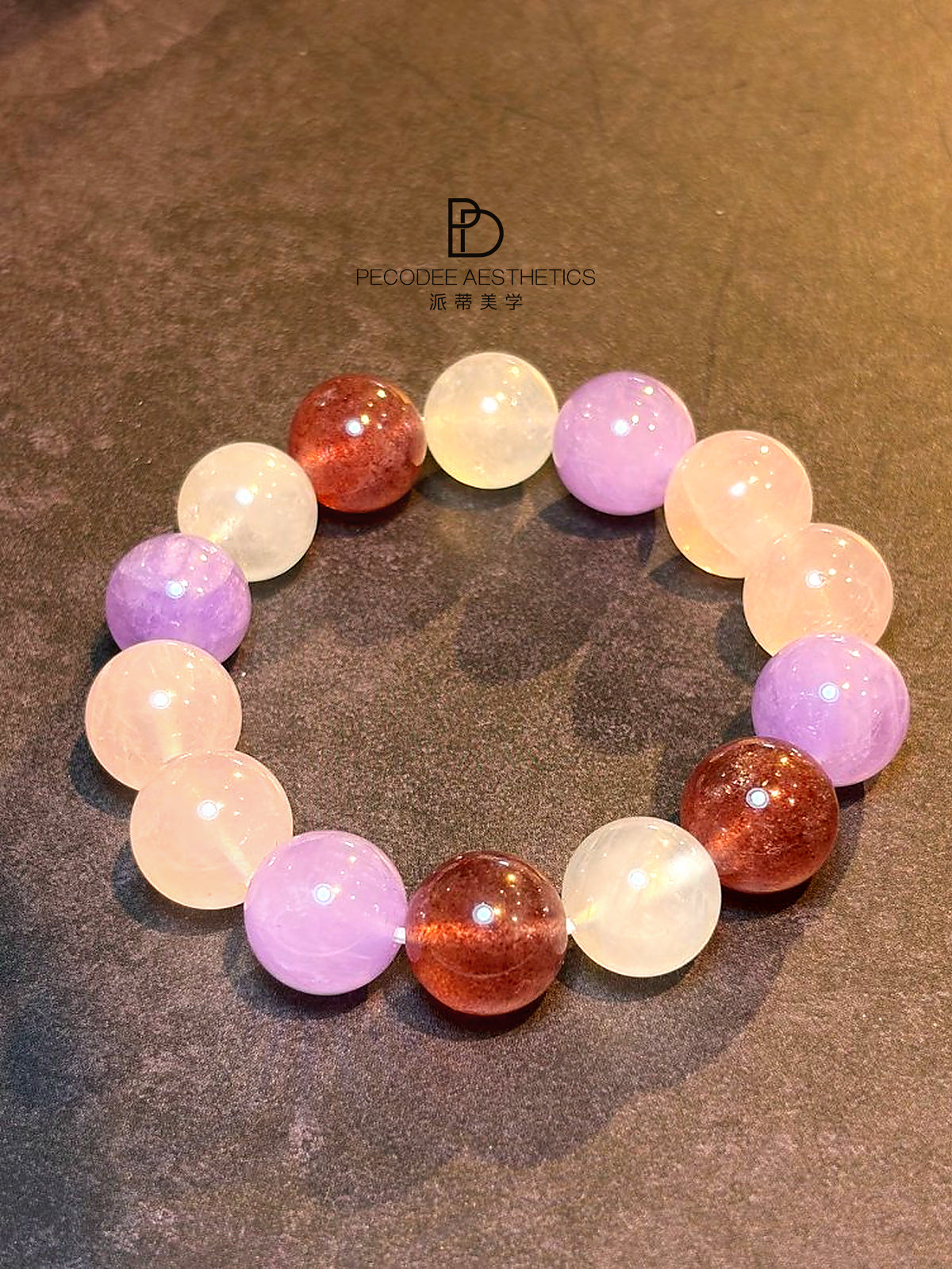 Round beaded bracelet with pink, lavender, and white beads, plus reddish-brown accents