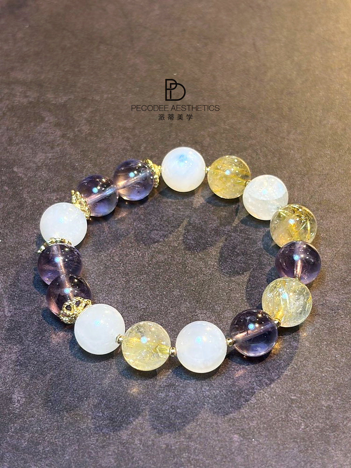 Beaded bracelet with round white, violet, and gold-toned glass beads