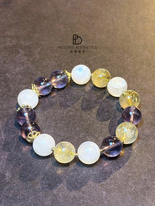 Beaded bracelet with round white, violet, and gold-toned glass beads